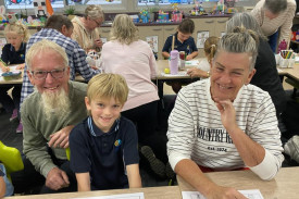 A photos of a St John’s Lutheran Primary School Portland student with her grandparents at Easter 2025 celebrations.