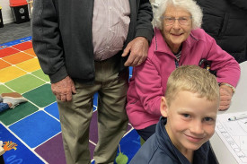 A photos of a St John’s Lutheran Primary School Portland student with her grandparents at Easter 2025 celebrations.