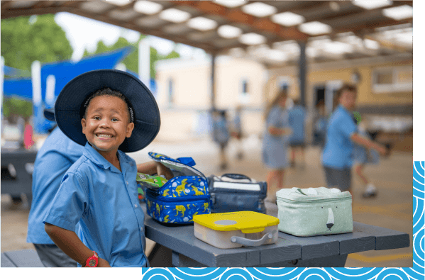 student-smiling-with-his-lunch-at-stjohns-lutheran-primary-school-portland.png