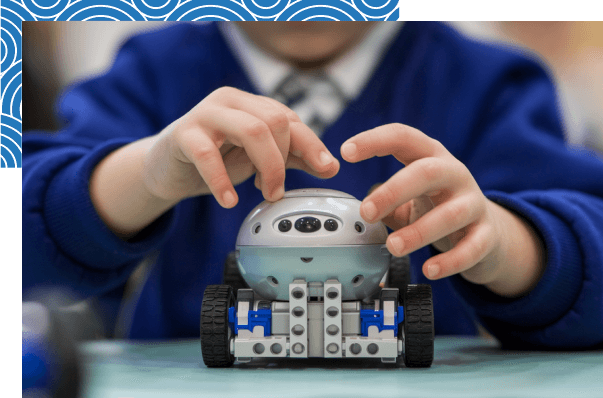 a-photo-of-a-young-child-handling-a-robot-stjohn-lutheran-primary-school-portland.png