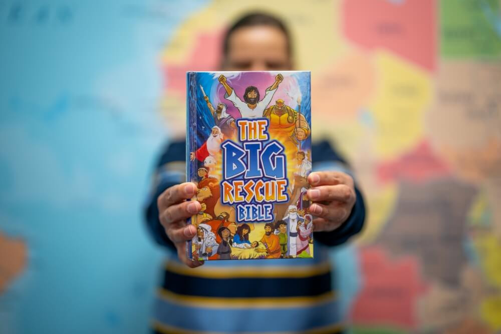 stjohns-student-holding-up-the-bible-st-johns-lutheran-primary-school-portland_1000px.jpg